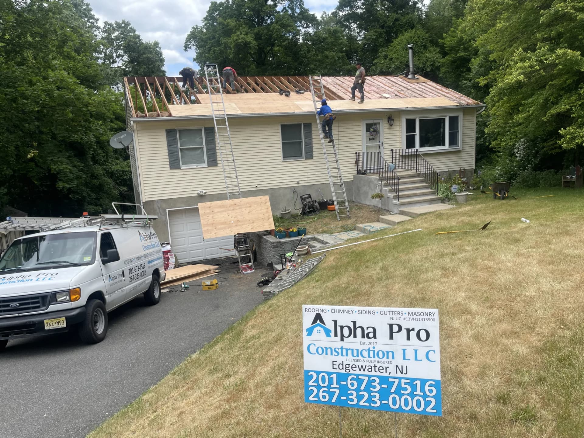 Alpha Pro Construction full crew tearing off an old roof on a ranch home in New Jersey