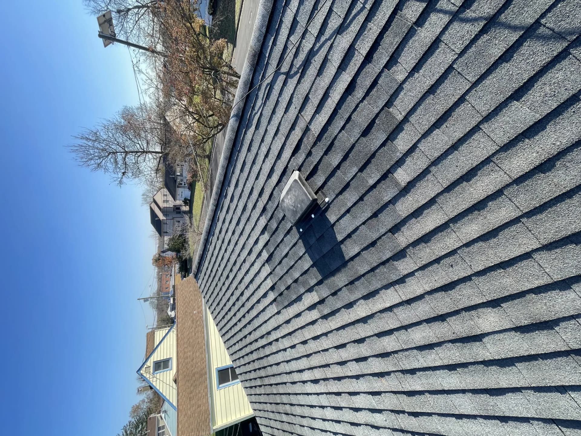 Box vent installed on a charcoal asphalt shingle roof slope during a residential roof project in New Jersey