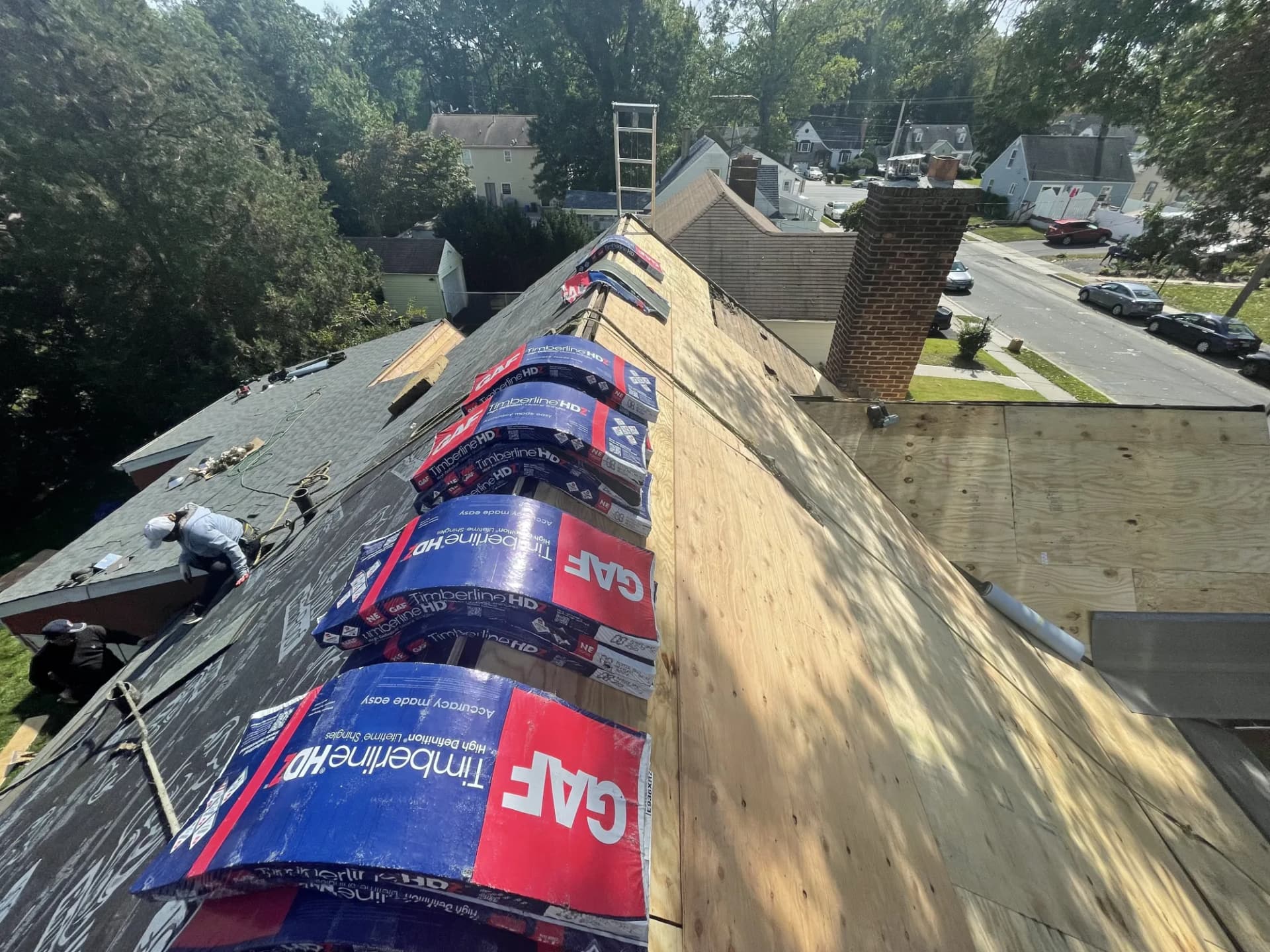 GAF Timberline HD shingle bundles staged along the roof ridge during a residential installation in New Jersey